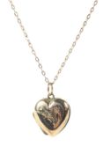 A 9ct gold pendant heart shaped locket and chain,