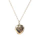 A 9ct gold pendant heart shaped locket and chain,