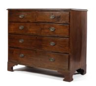 An Edwardian mahogany chest of drawers, with two short over three long drawers,