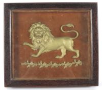 A late 19th century oak cased carved giltwood lion, the lion passant above a floral garland,