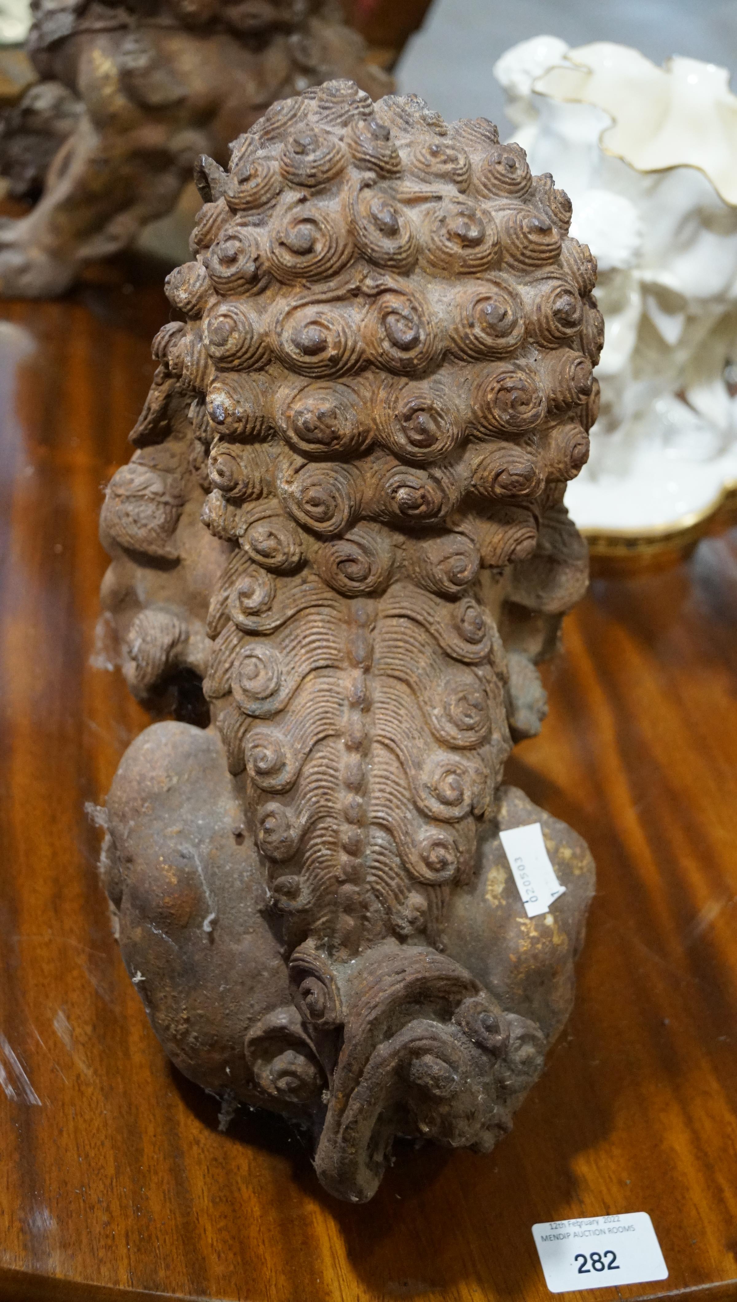 A pair of Chinese cast iron lions, each modelled seated with front paw on a brocaded ball, - Image 4 of 15