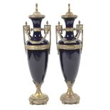 A large pair of French neoclassical style oviform gilt-metal mounted dark-blue ground Sevres-style