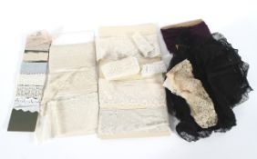 An assortment of 19th and 20th century lace, including bobbin and needlepoint examples,