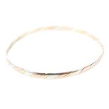 A 9ct gold tri coloured bangle,