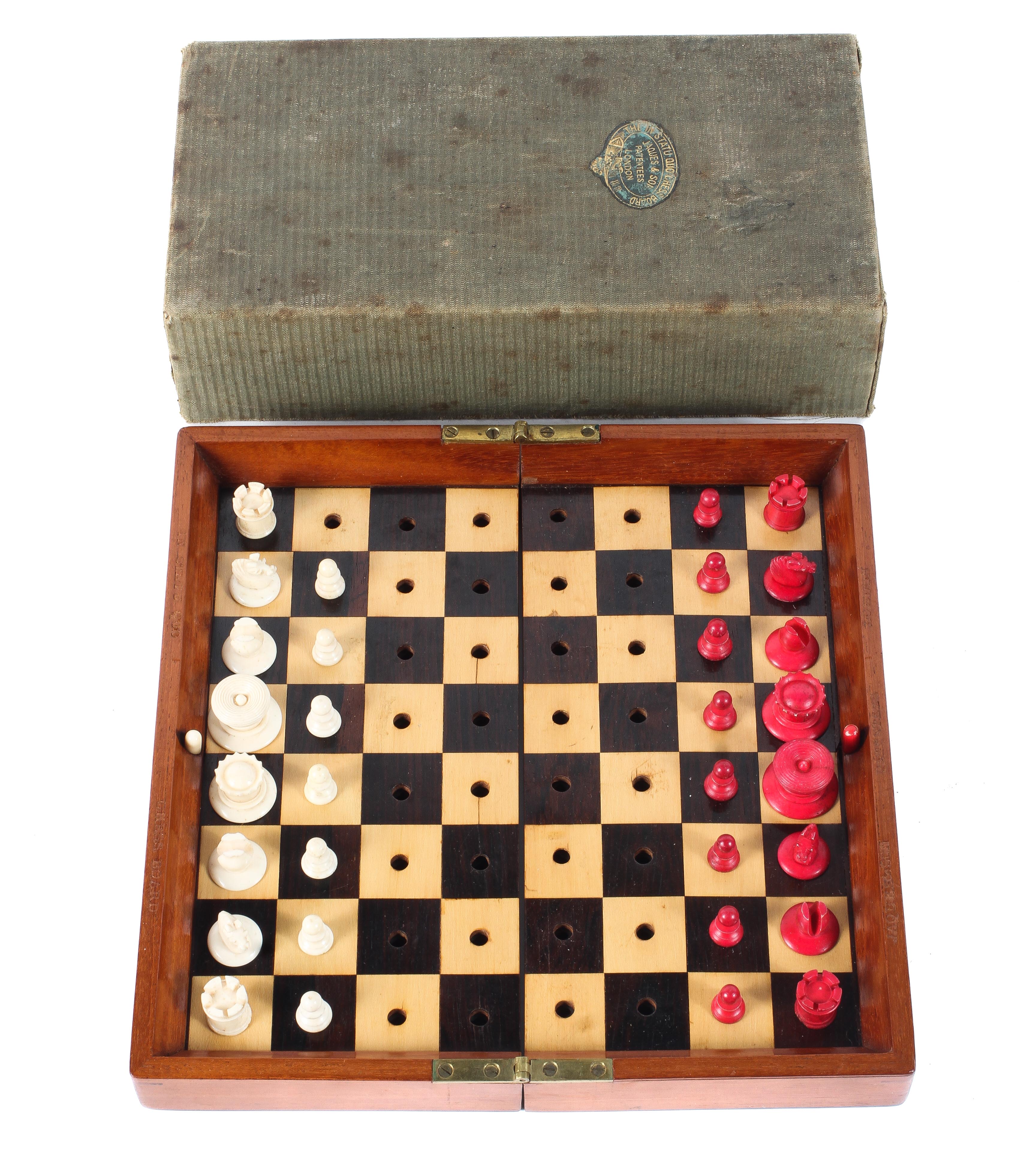 A Jacques & Son (London) travelling chess set in box, with folding mahogany chess board,