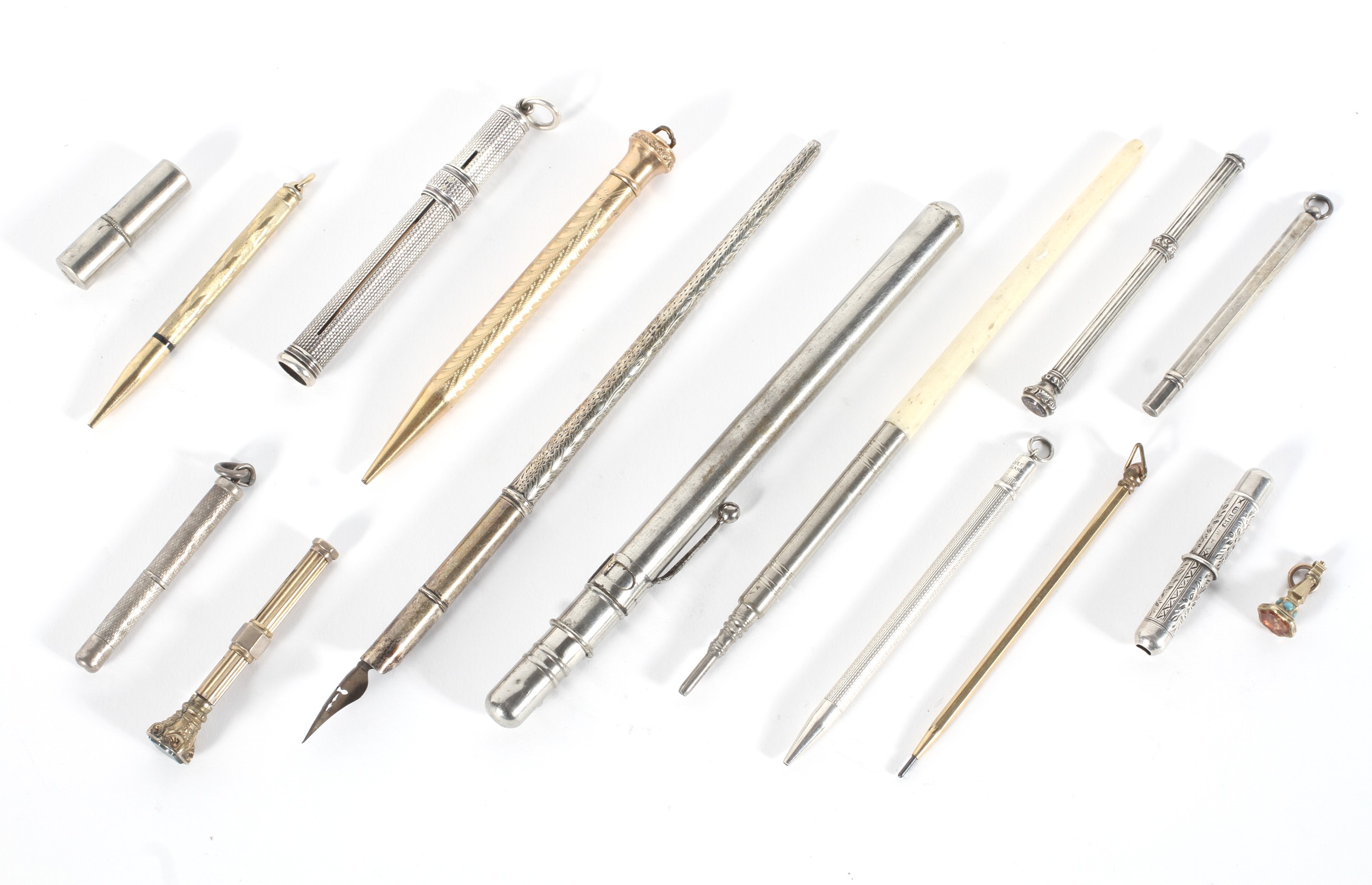 A collection of silver, white and gilt metal propelling pencils, late 19th - early 20th century,