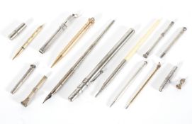 A collection of silver, white and gilt metal propelling pencils, late 19th - early 20th century,