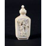 An early 20th century Chinese carved ivory snuff bottle and stopper-spoon, of facteted form,