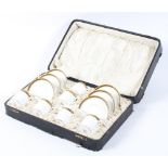 A Mintons cased set of six coffee cans and saucers in original presentation case
