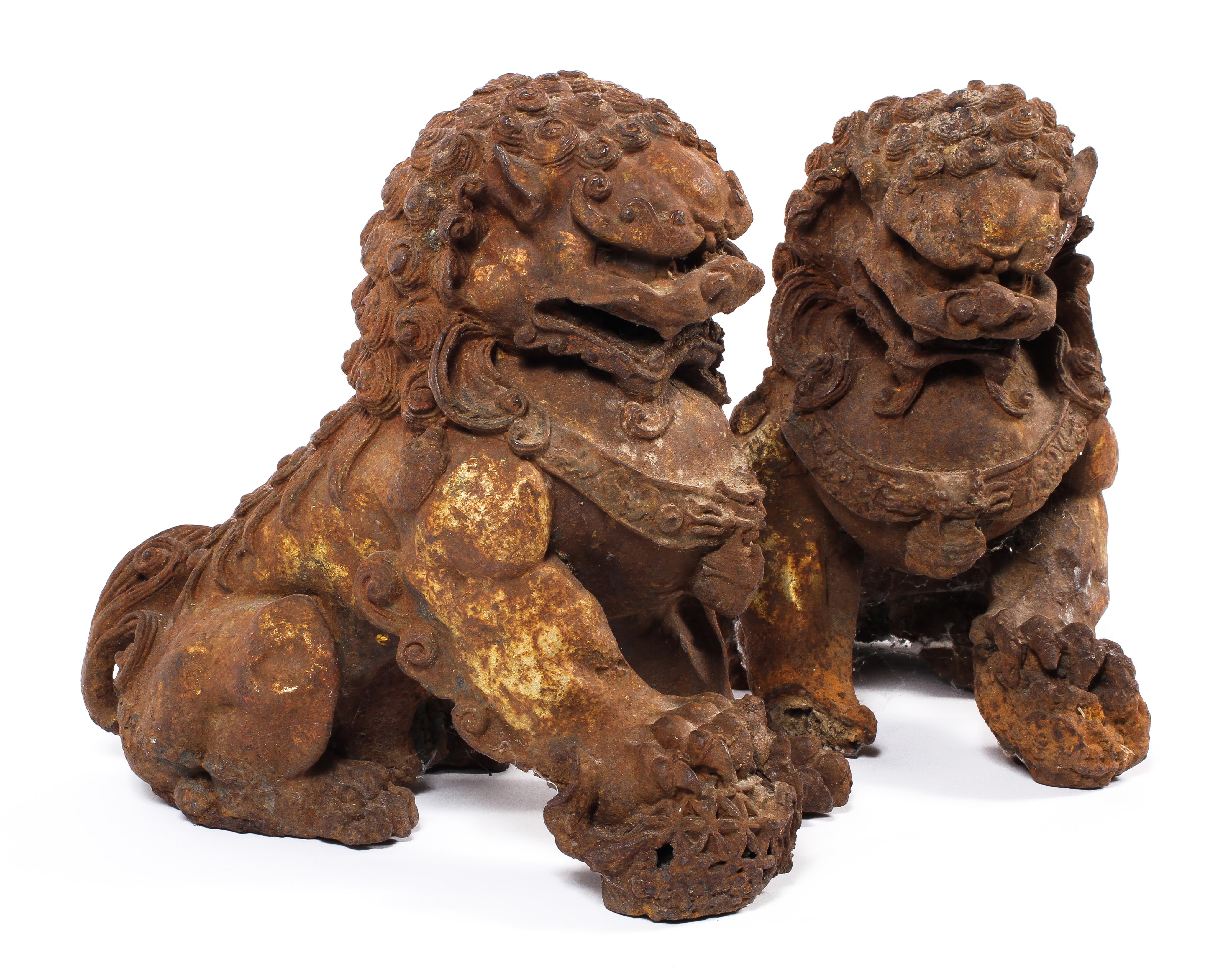 A pair of Chinese cast iron lions, each modelled seated with front paw on a brocaded ball, - Image 10 of 15