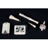 A small collection of late 19th century carved ivory items including aide-memoire, two wax seals,