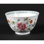 A Chinese famille rose tea cup decorated with peonies,