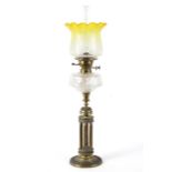 A late 19th century brass column oil lamp,