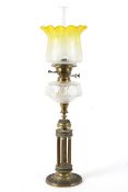 A late 19th century brass column oil lamp,