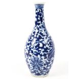 A Chinese blue and white vase with everted rim decorated with lotus leaves, flowers and tendrils,