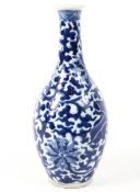 A Chinese blue and white vase with everted rim decorated with lotus leaves, flowers and tendrils,