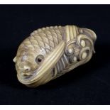 A Japanese Meiji carved ivory netsuke in the form of a koi carp, with signature to base