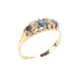 An 18ct gold sapphire and diamond dress ring, size 0,