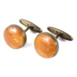 A pair of vintage amber glass cufflinks