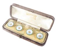 A cased set of four yellow metal shirt studs by Gowland Bros Ltd,