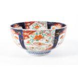 A 19th/20th century Japanese imari bowl decorated with reserves of birds and foliage,