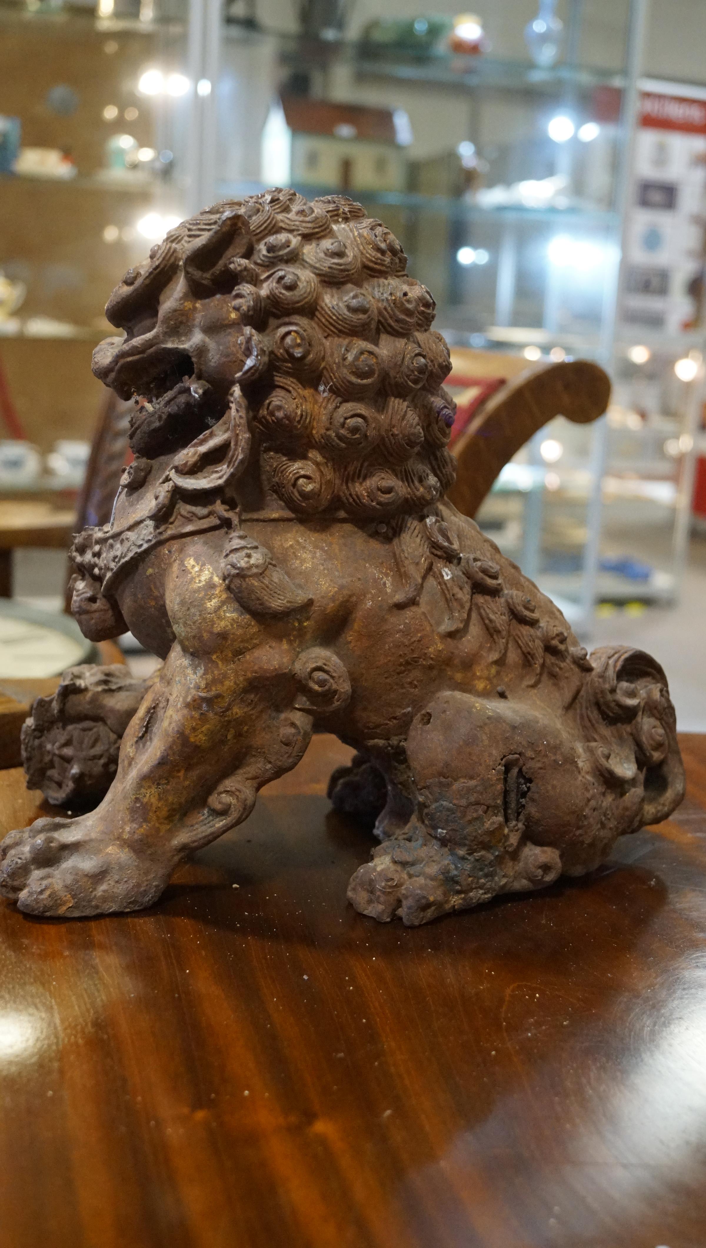 A pair of Chinese cast iron lions, each modelled seated with front paw on a brocaded ball, - Image 3 of 15