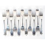 An assortment of eleven Victorian and later silver dessert forks, various makers,