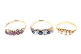 Three assorted 9ct gold dress rings, set with seed pearls, rubies and a sapphire and diamond ring,