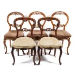 Three 19th century walnut balloon back dining chairs,