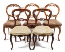Three 19th century walnut balloon back dining chairs,