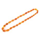 An Amber beaded necklace of Art Deco form, 37cm drop,