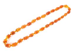 An Amber beaded necklace of Art Deco form, 37cm drop,