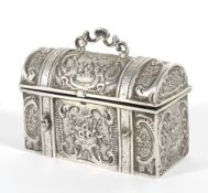 A white metal model of a 19th century metal bound travelling chest with all over cast decoration