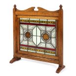 A Victorian Arts and Craft oak framed stained glass panel or screen,