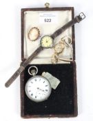 An assortment of watches and a brooch.