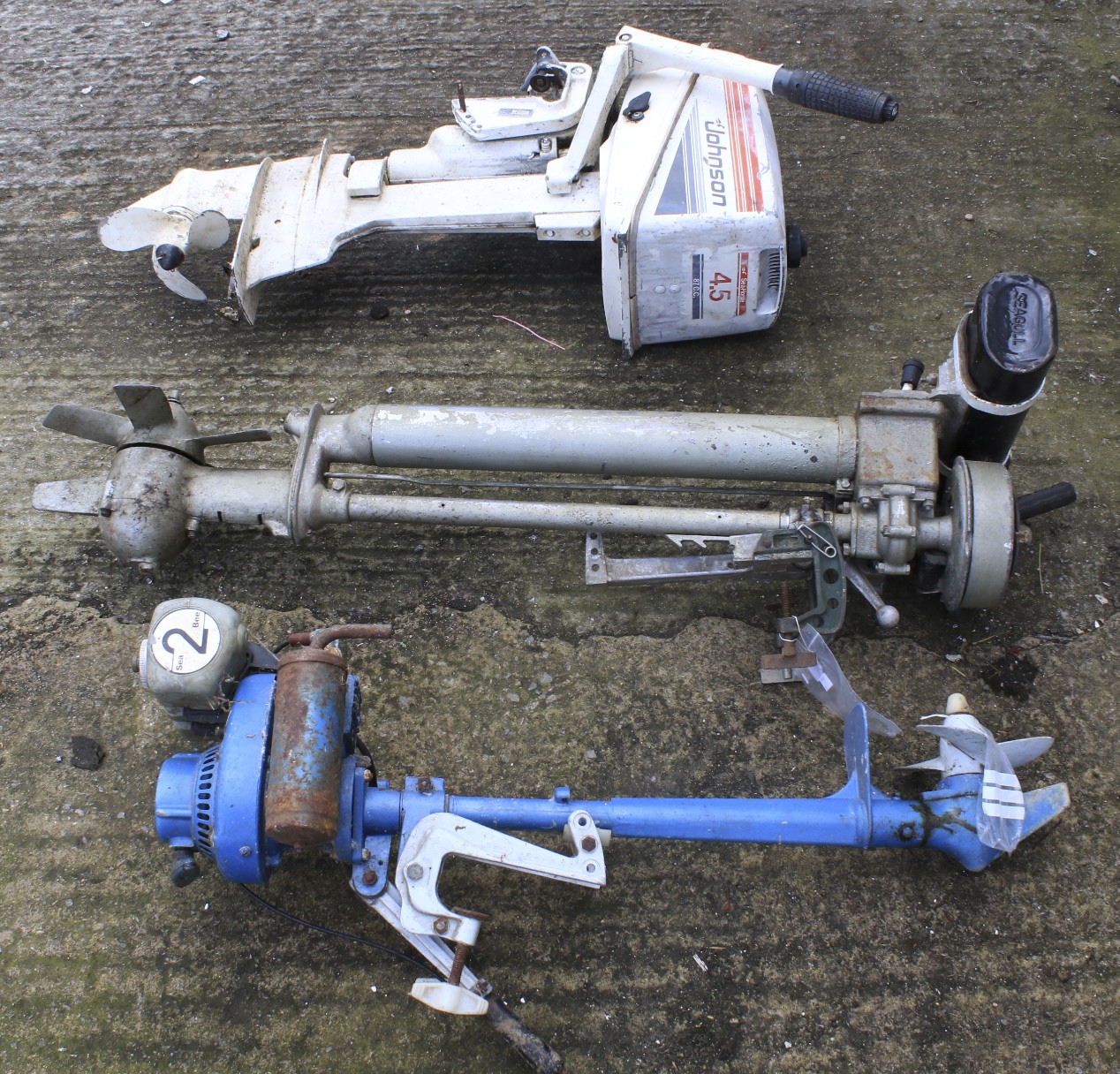 Three outboard motors by Johnson,