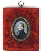 A 19th century minature portrait on ivory depicting a gentleman set in a stained red frame