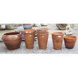 An assortment of terracotta garden pots.