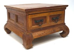 A 20th century wooden coffee table, with a single drawer to the front, on raised supports,