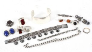 An assortment of silver jewellery including bracelets rings and earings