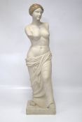 A modern fibreglass figure of a semi-clad Venus.