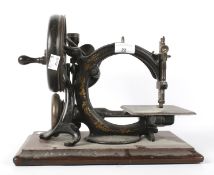 A late 19th/early 20th century Willcox & Gibbs sewing machine.