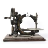 A late 19th/early 20th century Willcox & Gibbs sewing machine.