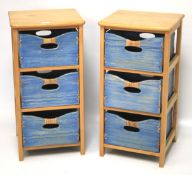 A pair of contemporary bedside tables with three blue painted box drawers.