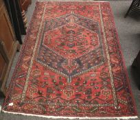 A Middle Eastern floor rug.