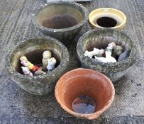 An assortment of garden pots together with gnomes and unpainted animals