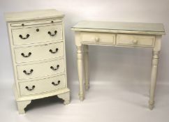 A white painted bow fronted chest of drawers and a contemporary hall table on turned supports.