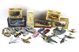 An assortment of die cast model vehicles, planes and cars.