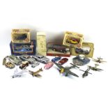 An assortment of die cast model vehicles, planes and cars.