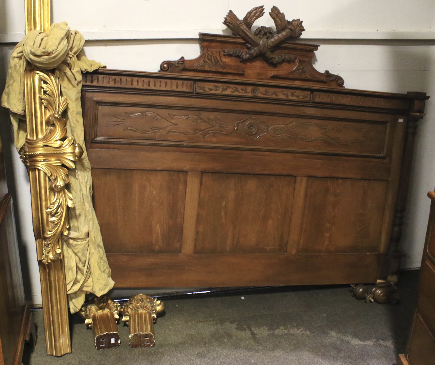 A Victorian style double bed headboard and a gilt carved bed canopy,